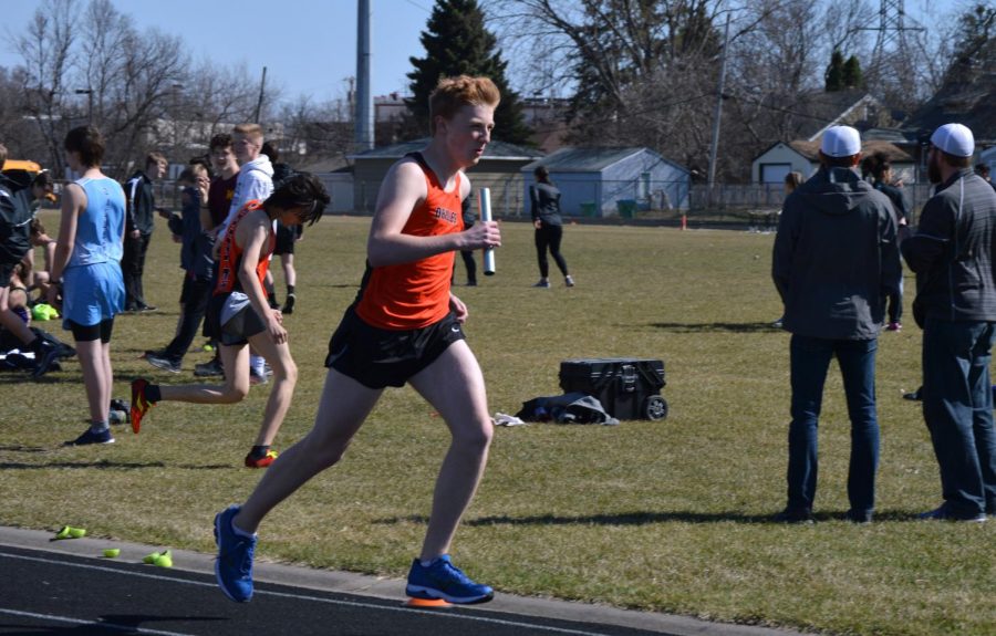 Freshman Maxwell Gohman runs the last leg of the 4X800 at a home track meet April 26. Boys track resumes its Section meet today at 2:30 p.m.