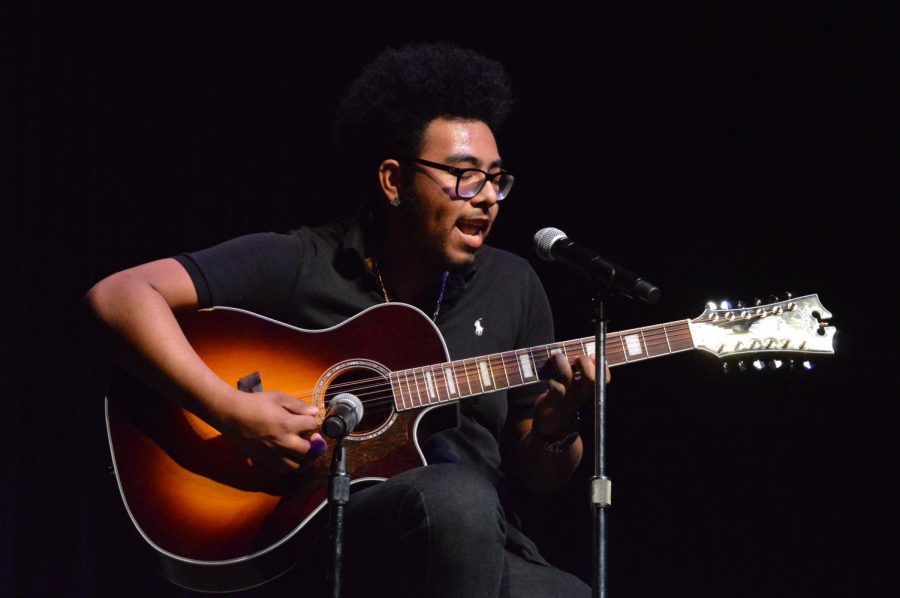 Senior Mario Marin Luna sings and plays a Spanish song on the guitar. Students and Teachers alike presented and performed their different cultures during the Multicultural Show May 1. 