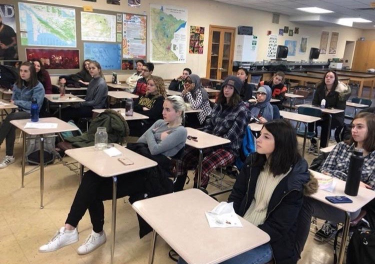 Students listen to a guest speaker at the clubs most recent meeting. Julie Schilz has been named the adviser for MED club next year.
