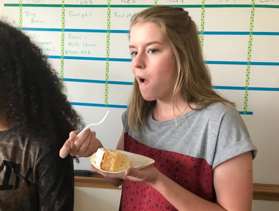 Senior Megan Perkins eats a slice of cake during her seventh hour math class June 1.  Her class held a bake off to celebrate the end of the school year.