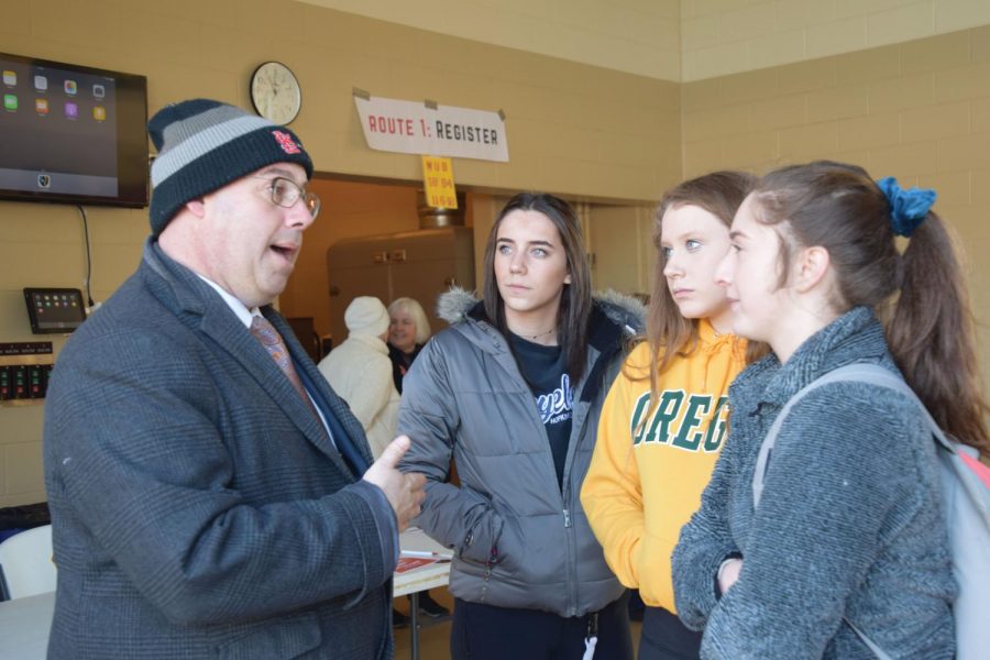 During the national high school walkout against gun violence March 14, juniors Ruby Stillman, Anna Wert and Franny Bevel talk to Mayor Jake Spano about actions he would take to support Park students seeking gun reform.