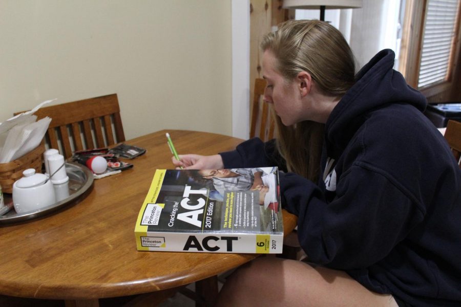 Senior Natalie Aune studies for the writing portion of the ACT. Many colleges recently dropped their ACT/SAT writing section requirement and now accept graded high school essays in its place.
