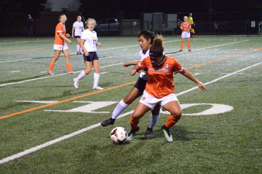 Junior Aliviah McClinton fights for ball possession towards the end of the second half of the game Sept. 17. McClinton scored one of two goals during Parks game against Bloomington Kennedy.