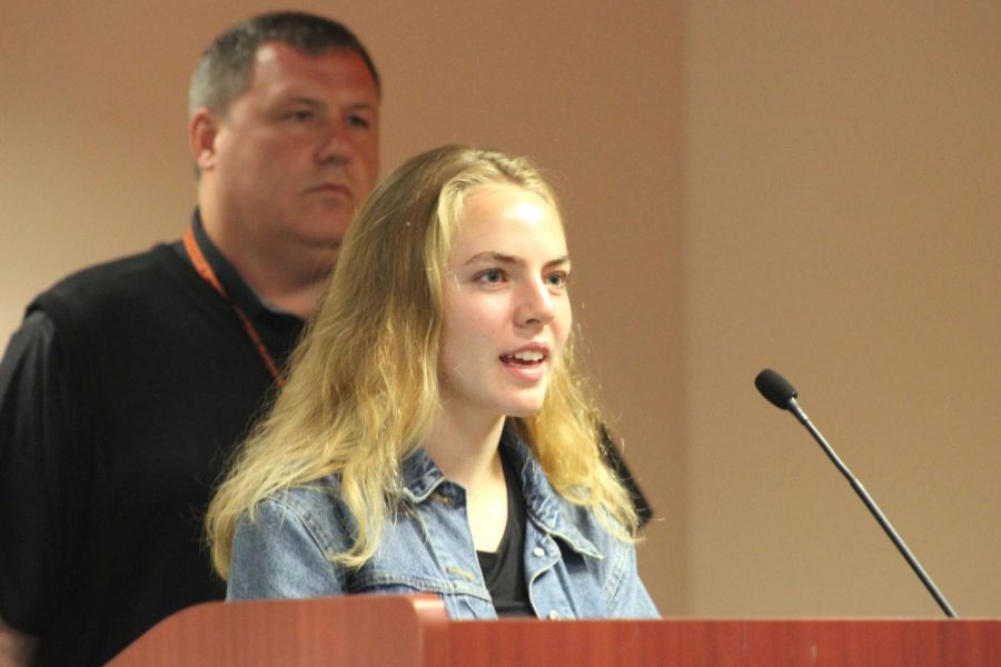 Junior Kaia Myers speaks in front of  the School Board. She presented her opinion and benefits of the captains training she has been attending. 
