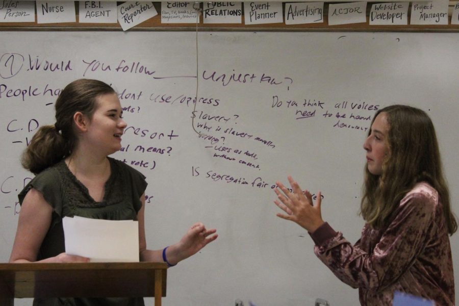 Freshmen Makenzie Lomont (left) and Samantha Rekstad work on debate skills during meeting Sept. 19. The debate team meets at 3:30 p.m. every Monday and Wednesday in room B222.