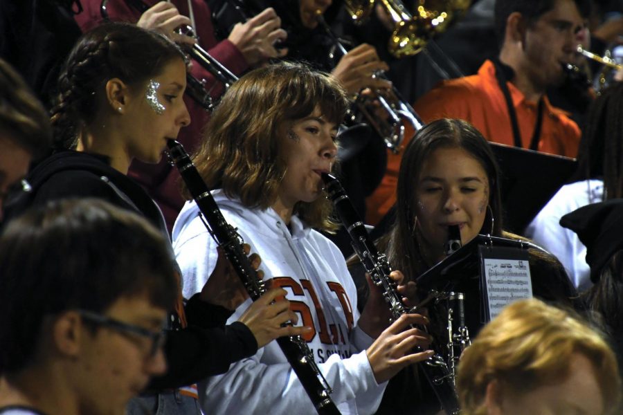 Seniors Claudia Stone, Lexi Lee and Cecilia Brown play in the pep band during Parks homecoming game Sep. 21. Lee participated alongside her peers at the Metro West All-Conference band.