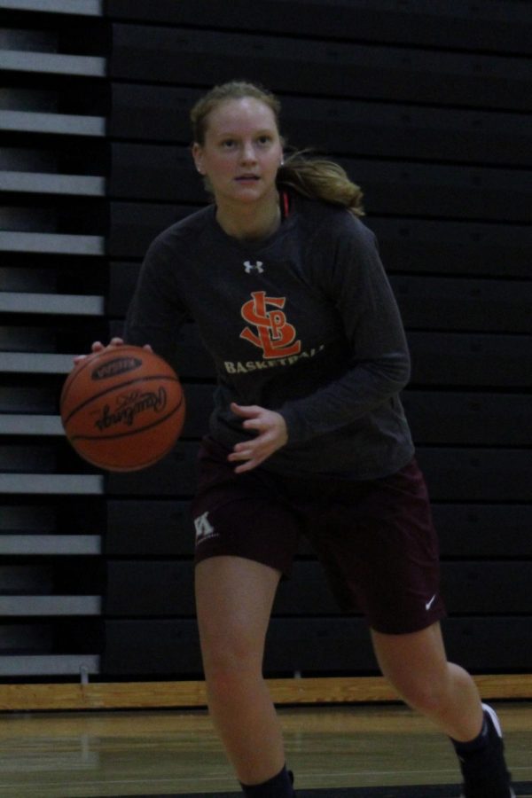 Senior Lindsey Olson dribbles the ball during a workout for the 2018-19 girls basketball season. The season starts Nov. 12.
