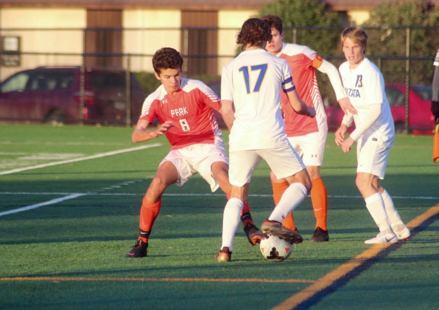 Senior Cole Beaton and junior Nick Riley attempt to take the possession of the ball during their third sections game against Wayzata. The game ended in Park losing 0-1 during over time.