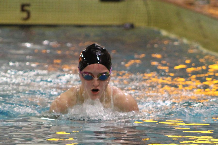 Junior Anna Long swims the breaststroke during the meet on Oct. 11. The team won 78-12 against Bloomington Kennedy. 