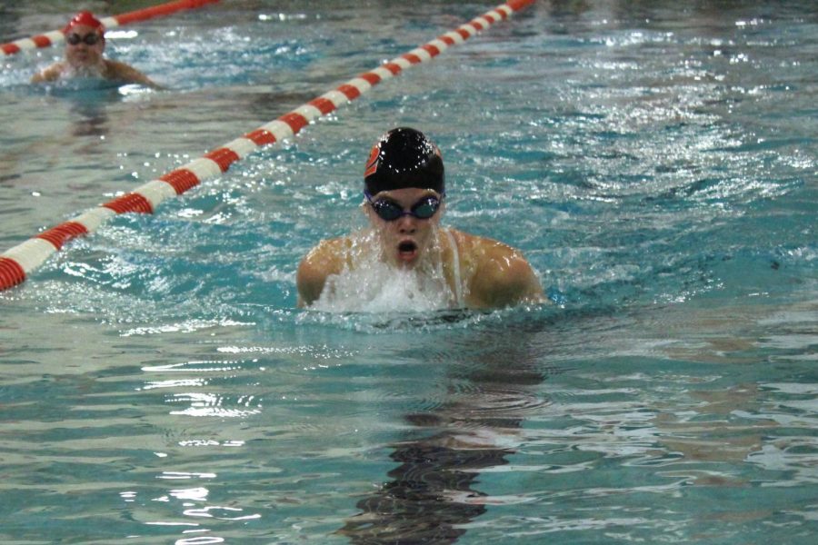 Junior Hattie Kugler swims breaststroke during the girls swimming practice Oct. 29. The team has returned to the high school pool for practices.  