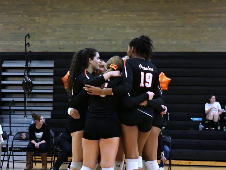 Players huddle together to regroup after a play. Park won against Benilde 3-0 during the senior night match on Oct. 16. The next game will be against Rochester Century High School at 5:15 Oct. 18 at National Volleyball Center in Rochester. 