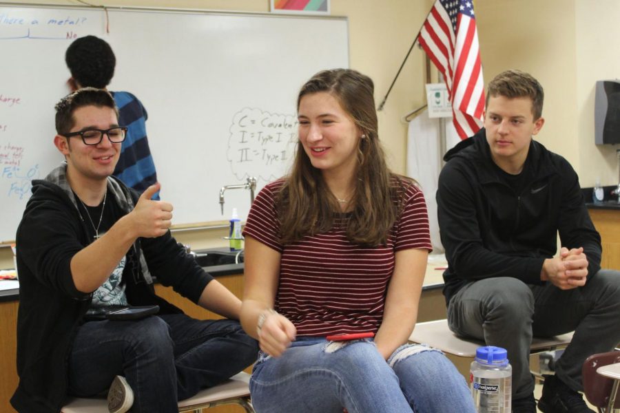 FCA leaders Aaron Ellingson and Libby Ramspurger discuss devotionals with member, sophomore Caleb Stokes at a meeting Oct. 30. 