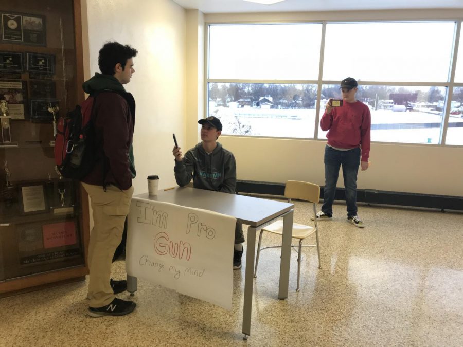 Junior Will Schwietering engages in a conversation with a Park student who happened to pass by his booth in the halls. The interaction was recorded by Schwieterings peer  Bryce Bonine for their IB English SL class. 