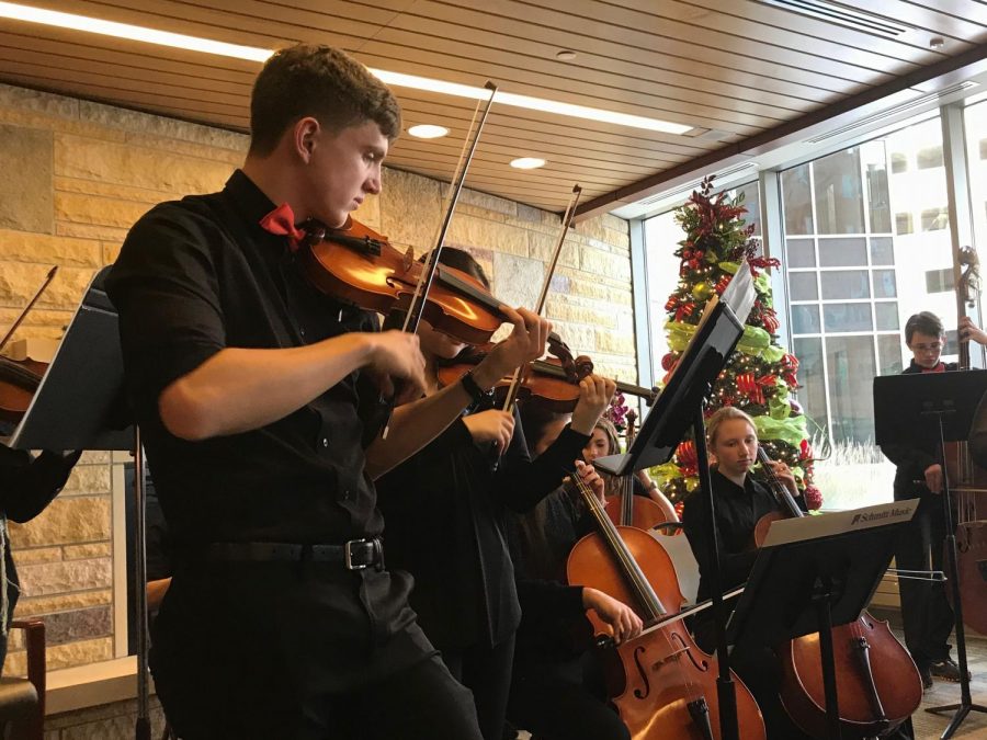 Senior Emmet Foner plays second chair first violin in the St. Louis Park High School Chamber Orchestra. The chamber orchestra performed twice at Methodist Hospital Dec. 6.