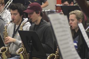 Juniors Tristan Rooney, Nathan Schemp and senior Natalie Aune practice saxophone. The band practices everyday for concerts and events.