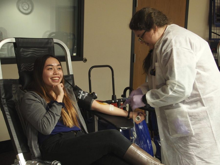Senior Bella Birkeland donates blood in C350 during the Memorial Blood Centers blood drive. The phlebotomists made sure everyone that donated felt comfortable and at ease while donating.
