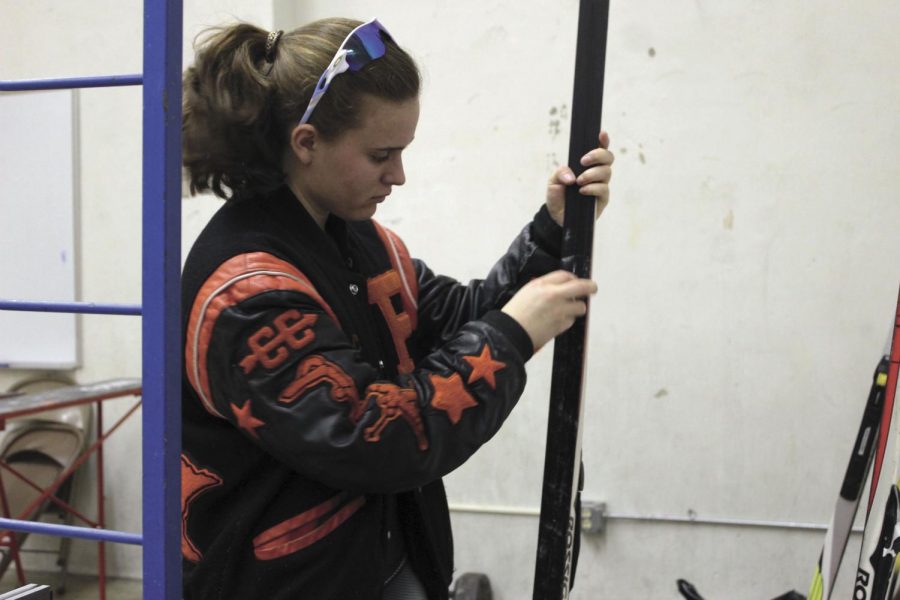 Senior Cece Schmelzle waxes her skis in preparation for her next qualifying meet. The race was on the weekend of Dec. 15-16. 