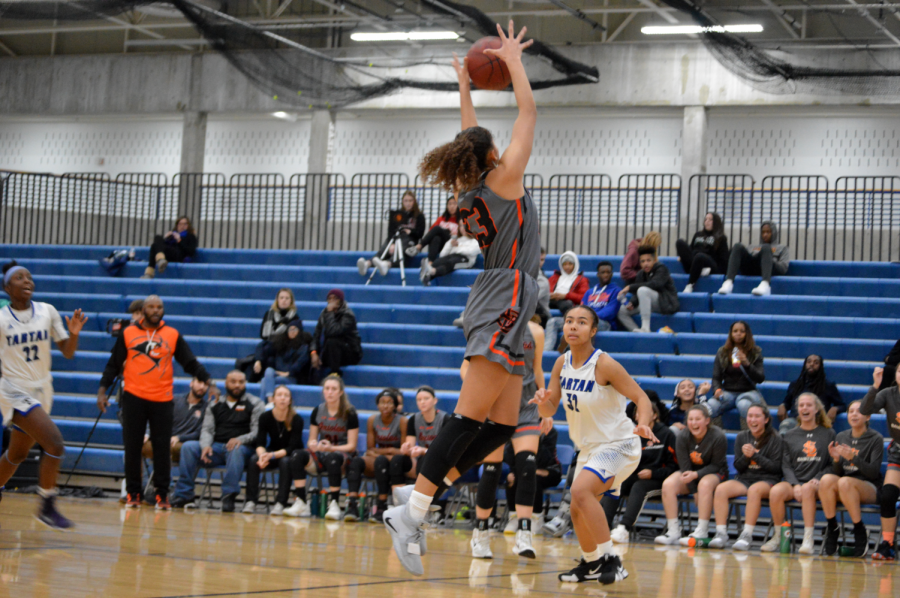 Sophomore Reagan Alexander catches pass over Tartan defender. Parks second victory of the season was during the Breakdown Tip-off Classic tournament.