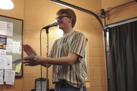 Junior Patrick Djerf announces the next performer at the Nest open mic night Dec. 14. The event was to promote the Nest and showcase students musical talents.