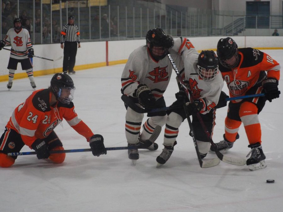 Sophomores Lucas Hand and McCabe Dvorak push through two Osseo players to keep possession. Park beat Osseo 7-3. 