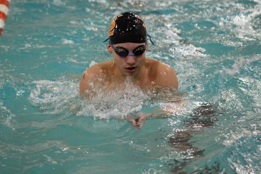 Sophomore Connor Coleman practices the breast stroke Jan. 2. Coleman and his team are preparing for the upcoming Bloomington Kennedy meet Jan. 3.