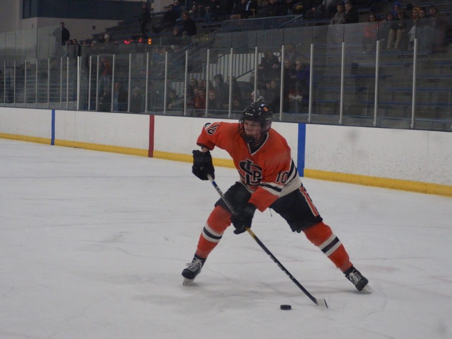 Sophomore Sam Berry attempts a shot after bringing the puck up from defense. Berry assisted sophomore Austin Amelse in scoring the fourth goal. Parks overall record is 8-9-0 as of Jan. 24 according to MN Hockey Hub. 