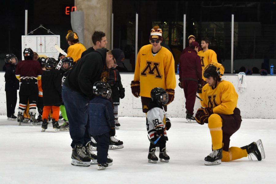 Young fans await their turn to meet the Gopher hockey players they look up to.