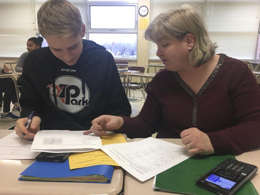 Sophomore Cameron Donahue and teacher Kristin Johnson work together on preparing for an upcoming Math Team tournament.
