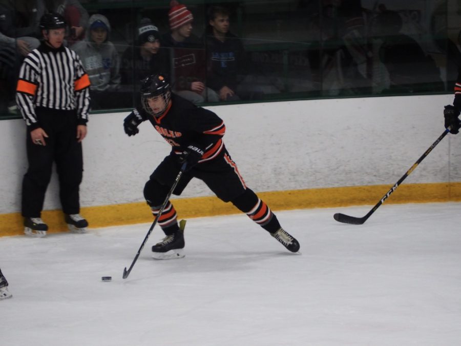 Senior John Meyer gets the puck and brings it up the rink in an attempt to score. Parks record as of Jan. 5 is 6-6-0. Its next game is against Chaska Jan. 10.