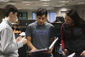 Senior project manager Christian Vega Celis works with a team member and an adult mentor during ACE club meeting. ACE meets Thursdays after school in C250A.