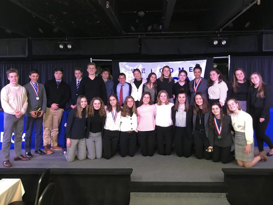 DECA+competes+at+District