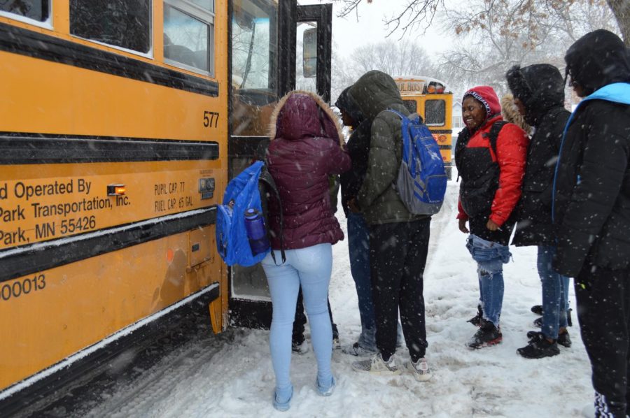 Students file into a school bus after the early dismissal at 2:10 p.m. Feb. 7. Park schools will have a two-hour late start Feb. 8 due to the forecasted winter weather.