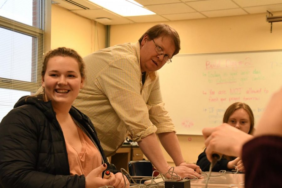 Senior Erica Dudley laughs with her fellow Quiz Bowl members during Quiz Bowl practice in preparation for Nationals. 