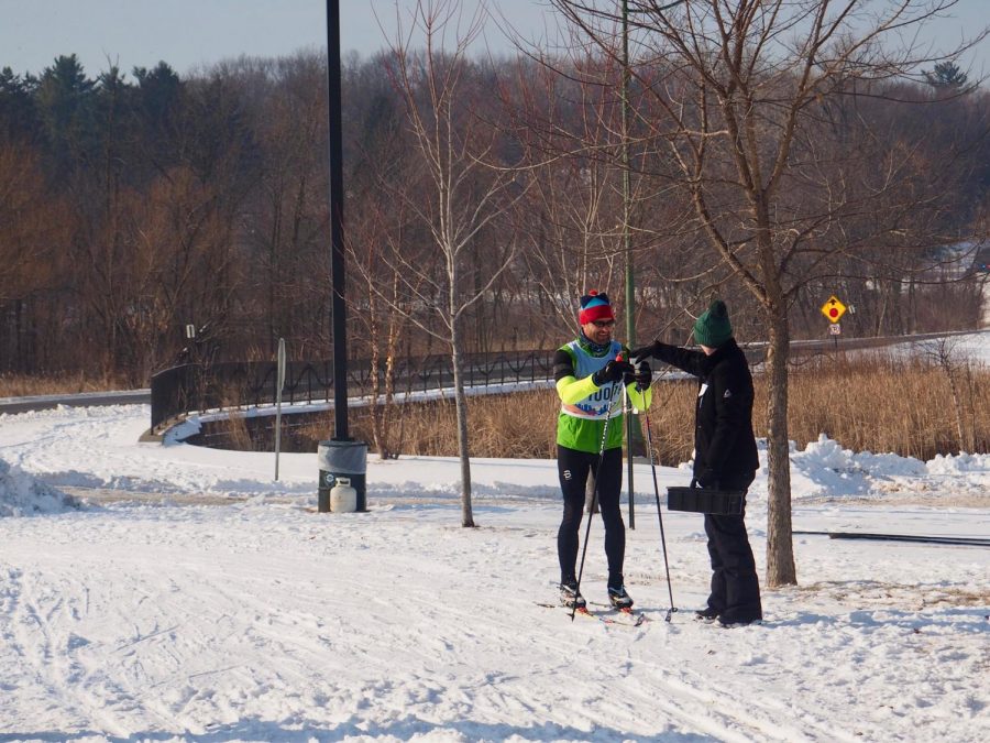 Sophomore Marit Gabel volunteers Feb. 2 to hand out beverages to the Loppet Classic Marathon skiers. Loppet hosts races for skiers, bikers and snowshoers with over 20 events throughout the weekend. Ski races range from the 1k Minne-Loppet to 37k marathon races. 