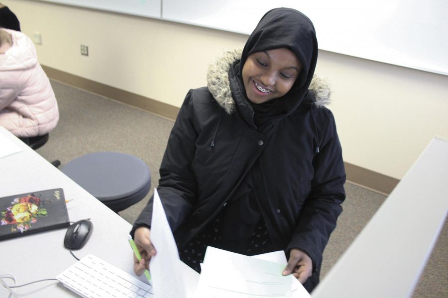 Junior Ayan Ali works on a packet during her IB English SL class Feb. 11 in C153. She was able to complete additional English credits by taking elective credits at her school in Somalia that are required credits at Park.
