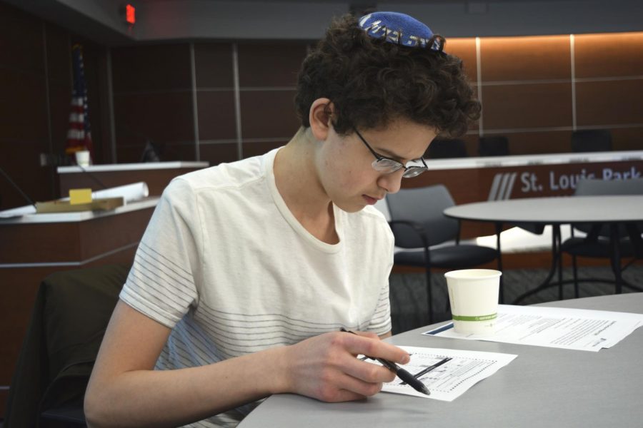 Junior Yoni Potter reviews sample ballots for the 2019 St. Louis Park municipal election which will utilize ranked-choice voting for the first time. 