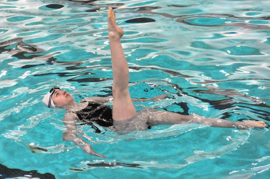 Junior Ava Tronson performs a ballet leg figure for a panel of judges. Park swimmers took three of the top four places at the meet March 21.
