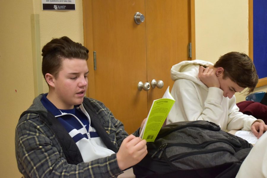 Sophomore Isaac Scott reads his lines aloud during the read through for the spring play March 13. The spring play this year is Prelude to a Kiss.