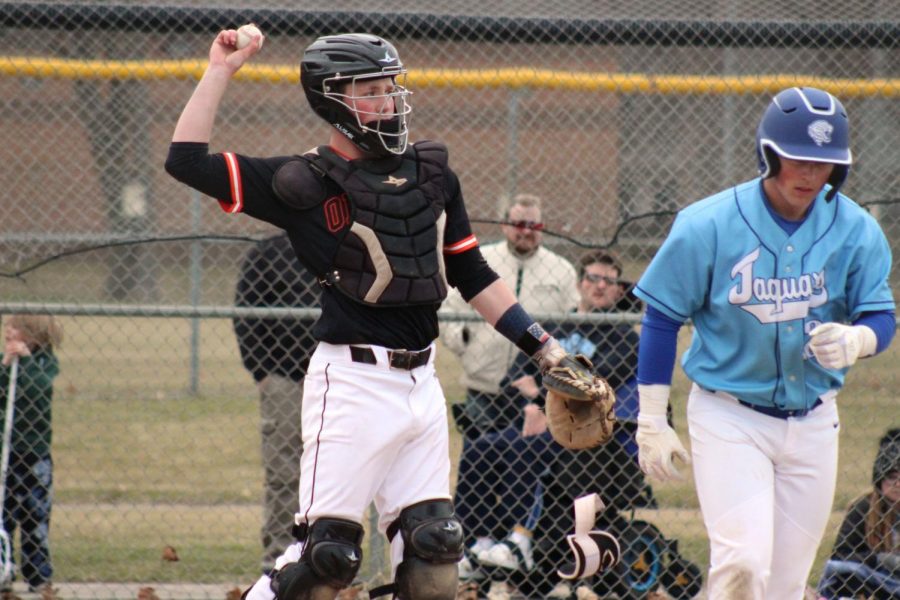 Sophomore Sam Hunt throws baseball back to the pitcher. Park Baseball won the game against Bloomington Jefferson 1-0.