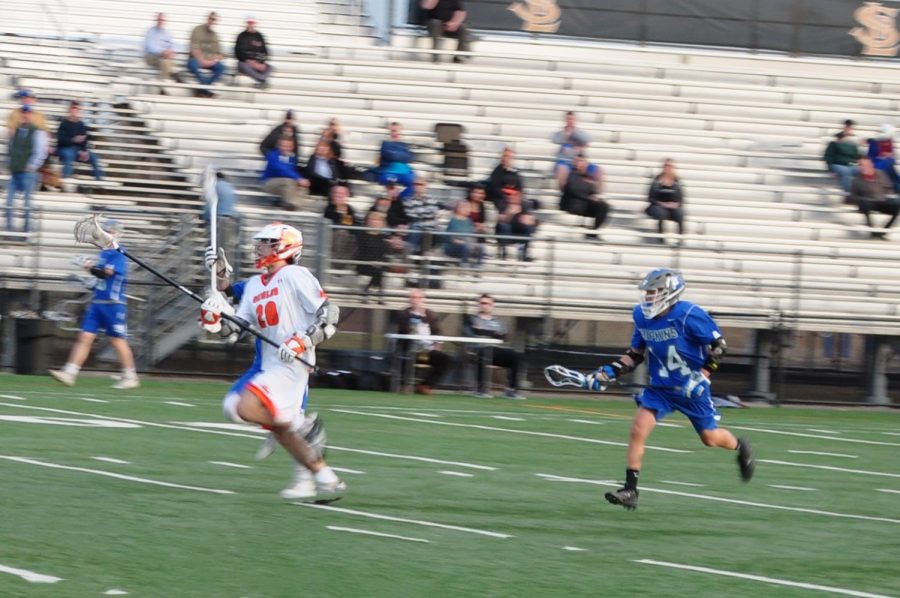 Junior Alexander Hager runs to advance the ball toward the opponents goal. Park defenders allowed zero goals during the second quarter of their game against Hopkins April 16.
