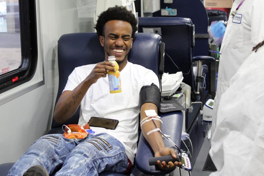 Mihretu Ravaz gets blood taken at a blood drive May 29 through the school with Memorial blood center.