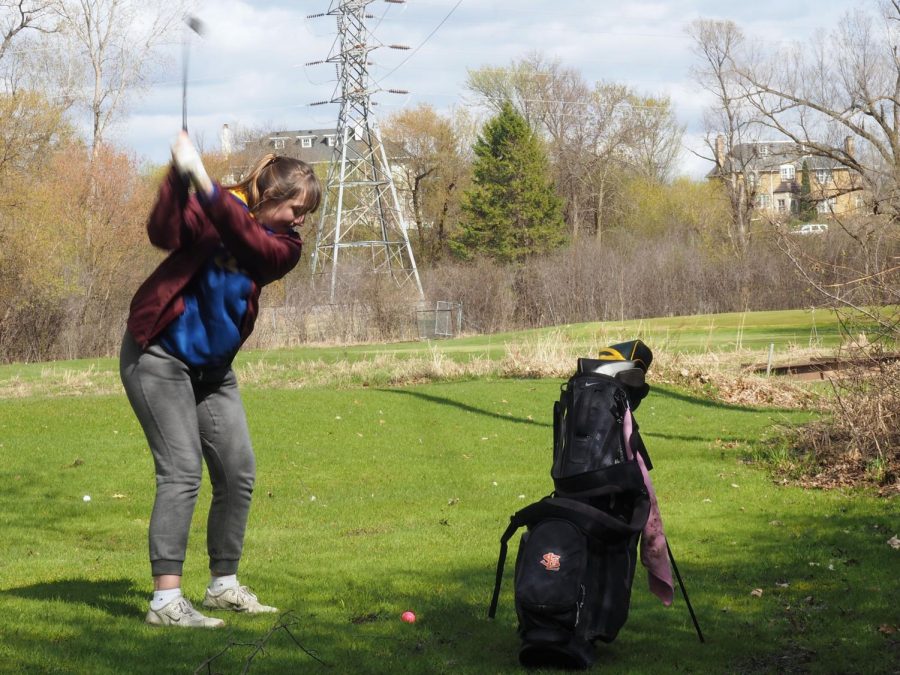 Sophomore girls golf member Brianna Dahl takes a swing on the fairway at the match May 2 against Southwest at Theodore Wirth Golf Course. The next match will be May 6 at Crystal Lake Golf Course.