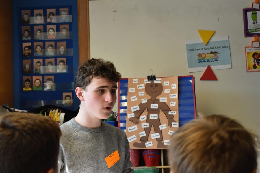 Sophomore Leo Dworsky models the notes in one of many songs he is teaching to fourth and fifth grade theater kids at Aquila Elementary School, May 9. The students will perform a showcase for parents and community members June 5.