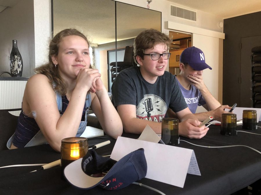 Seniors Ilsa Olsen, Neil Walsh and Cyrus Abrahamson await their opponents for a preliminary round at Quiz Bowl nationals May 25. National Academic Quiz Tournaments (NAQT) annual national tournament was held in Atlanta, Georgia.