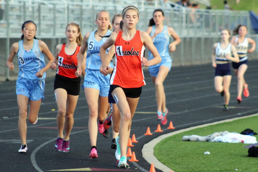 Freshman Josie Mosby races in the two mile race at Conference May. 15. The girls track and field team placed first in Conference with 189 points. 