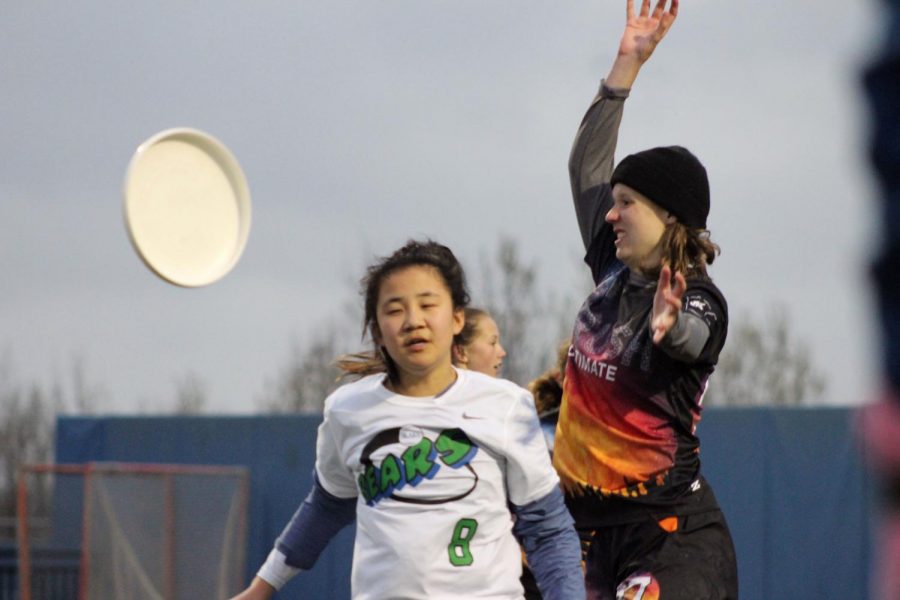 Junior Svea Bleske jumps to block a Blake player from catching the disc. Girls Crush ultimate won the game against Blake 9-8 April 30. 