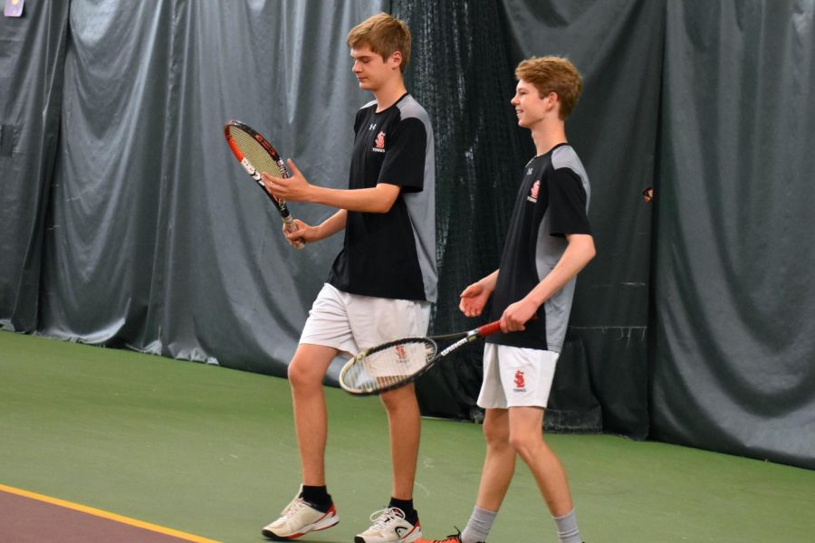 After winning the game point, partners Clayton Horseman and Cory Kleve celebrate winning a match against Benilde St. Margarets. 