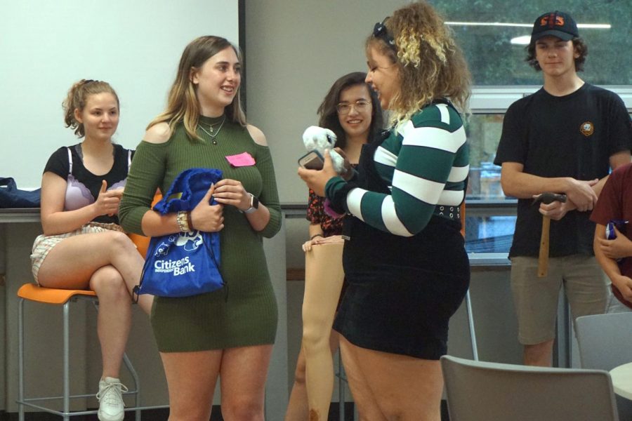Senior Nietzsche Deuel passes down her legacy to freshman Kenzie Peschong June 4. Theater had its end of the year banquet, in which they voted for a new Thespian Society president and said goodbye to the seniors.