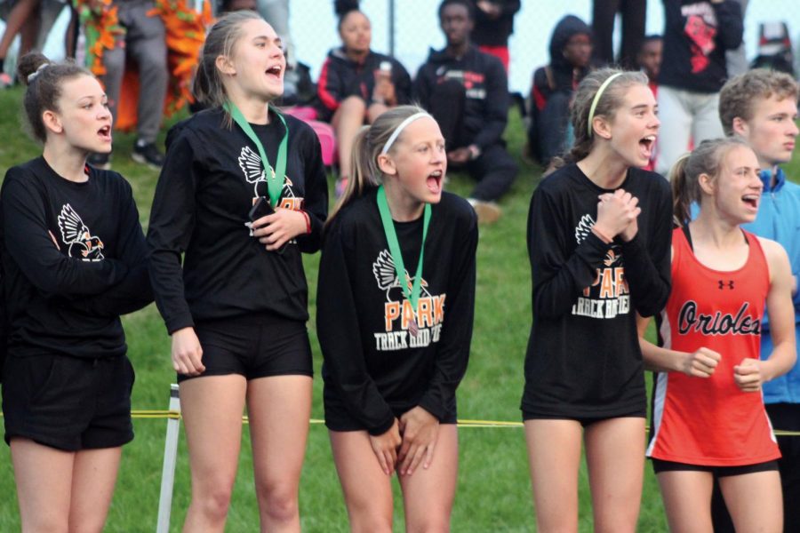 Seventh grader Ruby Massie, senior Olivia Mosby, freshmen Olivia Brown, Josie Mosby and seventh grader Jersey miller cheer on fellow teammates at Sections. May 30. 
