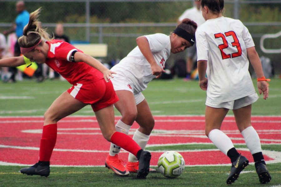 Senior Aliviah McClinton fights for the ball in the game against BSM. Due to the game the soccer teams record is now 5-3-2.